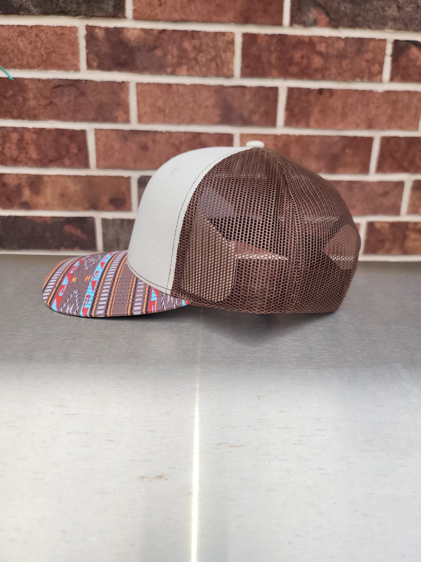 Trucker cap with southwestern style bill